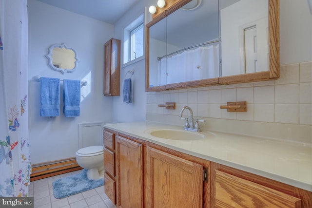 bathroom with tasteful backsplash, vanity, tile patterned floors, and toilet