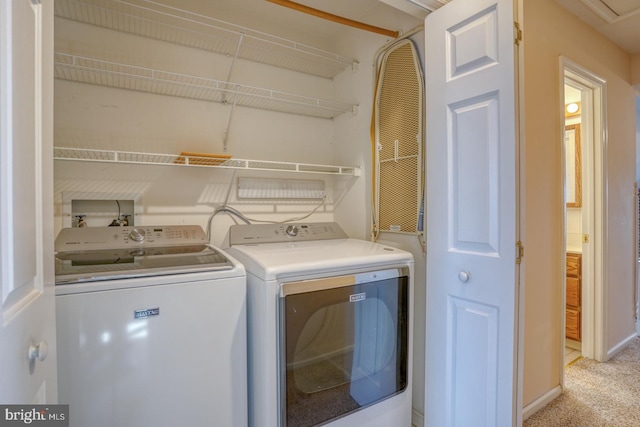 washroom featuring separate washer and dryer and light colored carpet