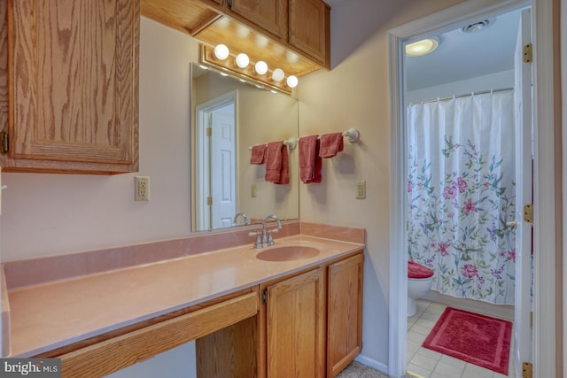 bathroom featuring vanity, toilet, and a shower with shower curtain