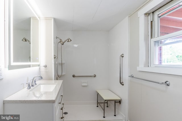 bathroom with vanity and walk in shower