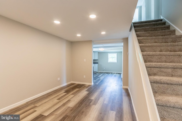 staircase featuring hardwood / wood-style floors