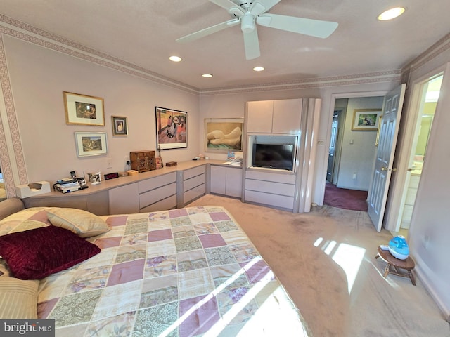 bedroom featuring crown molding, ceiling fan, and light carpet