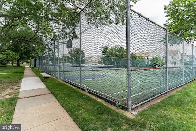 view of tennis court featuring basketball court