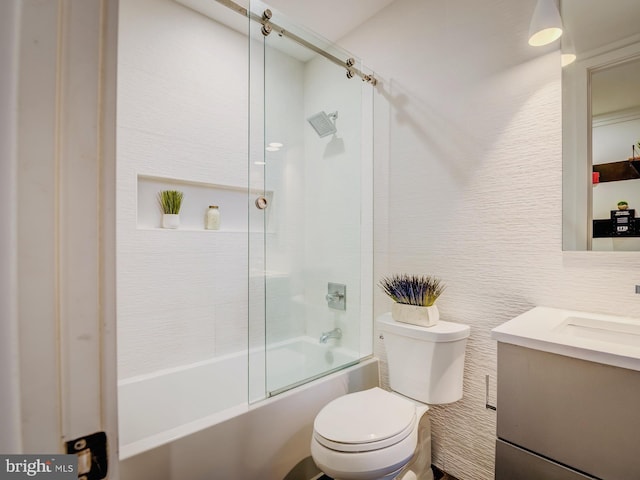 full bathroom featuring vanity, shower / bath combination with glass door, and toilet