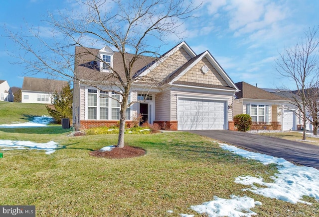 view of front of home featuring a garage and a front lawn