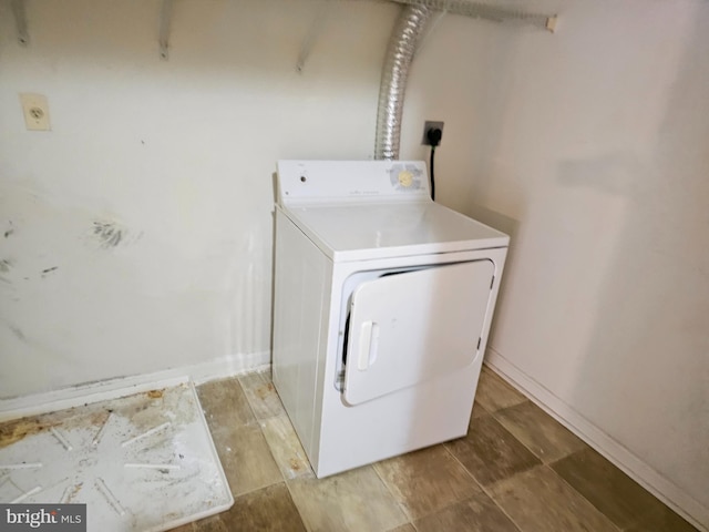 clothes washing area featuring washer / clothes dryer