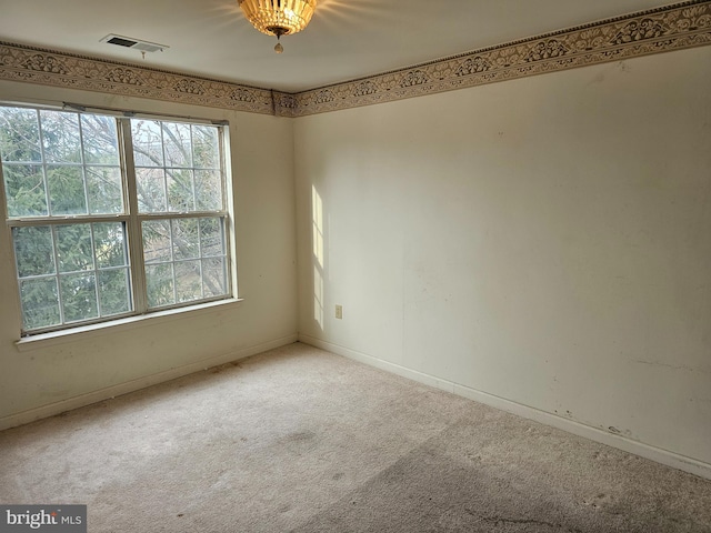 unfurnished room with light colored carpet