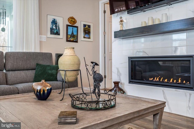 living room with a tile fireplace