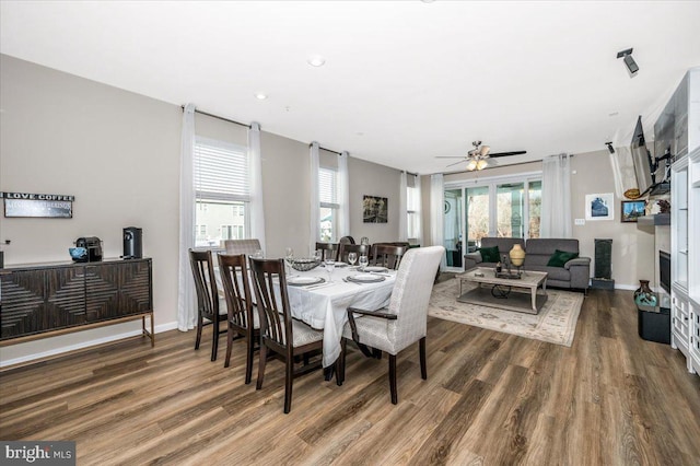 dining room featuring dark hardwood / wood-style floors and ceiling fan