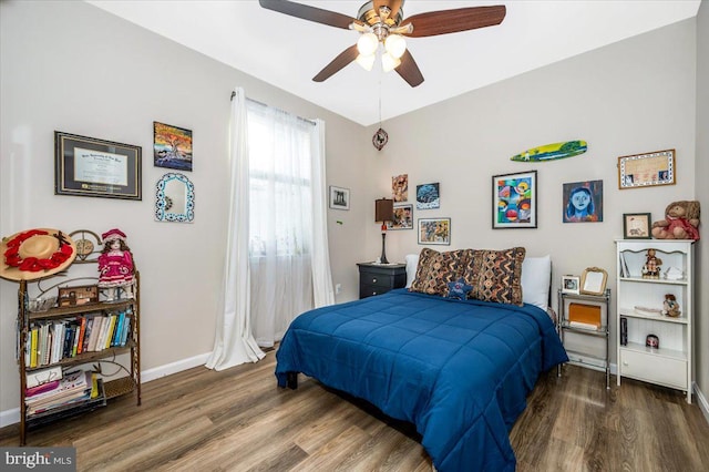 bedroom featuring hardwood / wood-style flooring and ceiling fan