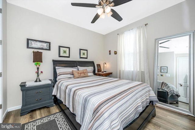 bedroom featuring ceiling fan and light hardwood / wood-style flooring