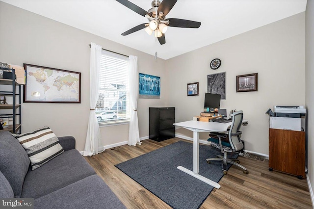 office area with hardwood / wood-style floors and ceiling fan