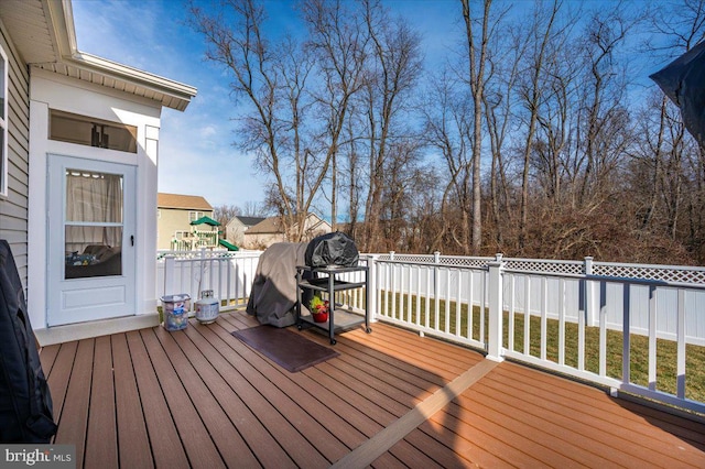 wooden terrace with a playground