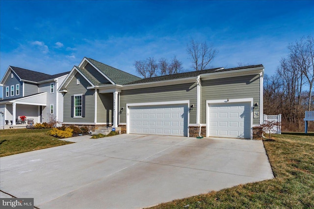 view of front of property with a garage and a front yard