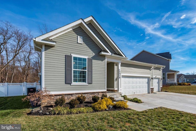 view of front of house featuring a garage and a front lawn