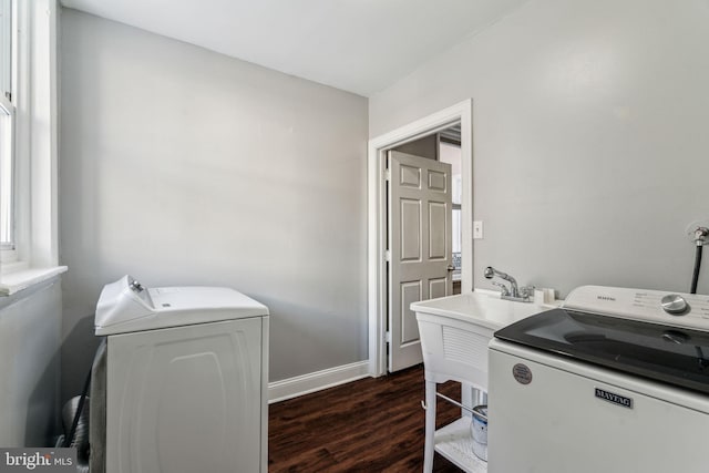 laundry area featuring dark hardwood / wood-style floors and washing machine and clothes dryer