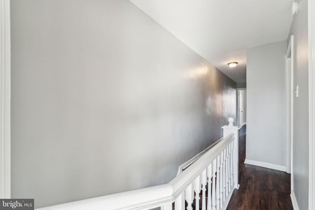 corridor with dark hardwood / wood-style floors