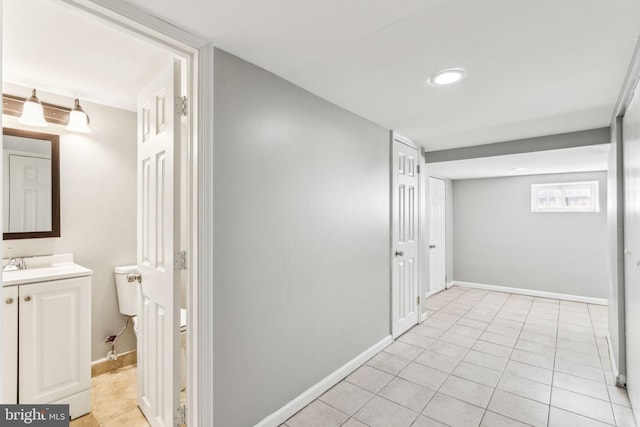 interior space featuring sink and light tile patterned floors