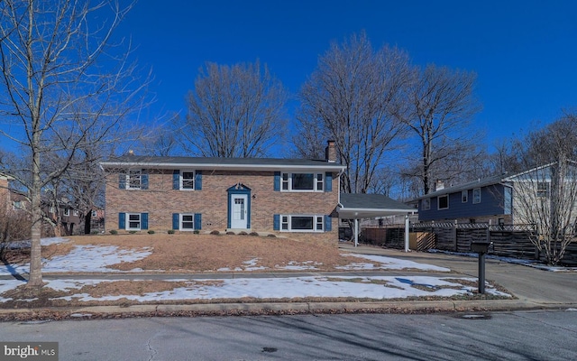 split foyer home with a carport