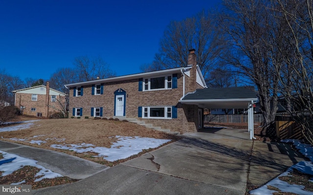 bi-level home featuring a carport