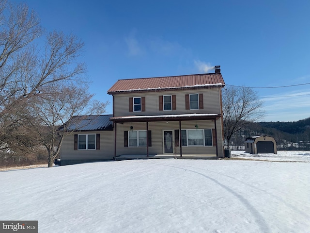 view of snow covered house