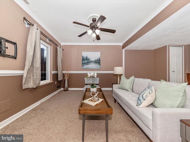 living room featuring crown molding, ceiling fan, and carpet flooring