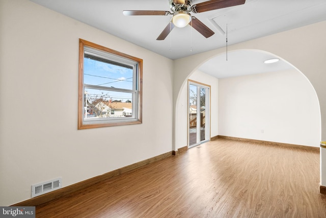 unfurnished room featuring ceiling fan and wood-type flooring