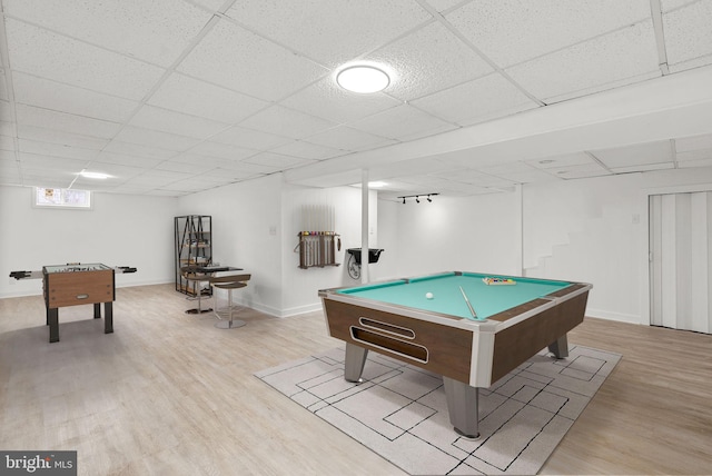 rec room featuring pool table, a paneled ceiling, and light wood-type flooring