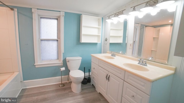 full bathroom featuring washtub / shower combination, vanity, toilet, and hardwood / wood-style floors