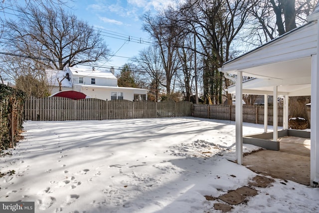 view of yard layered in snow