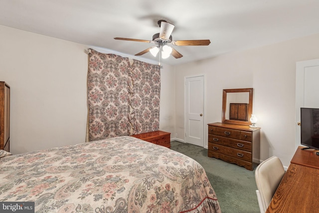 bedroom featuring dark colored carpet and ceiling fan