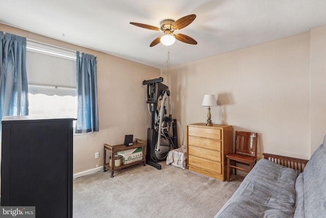 living area with carpet floors and ceiling fan