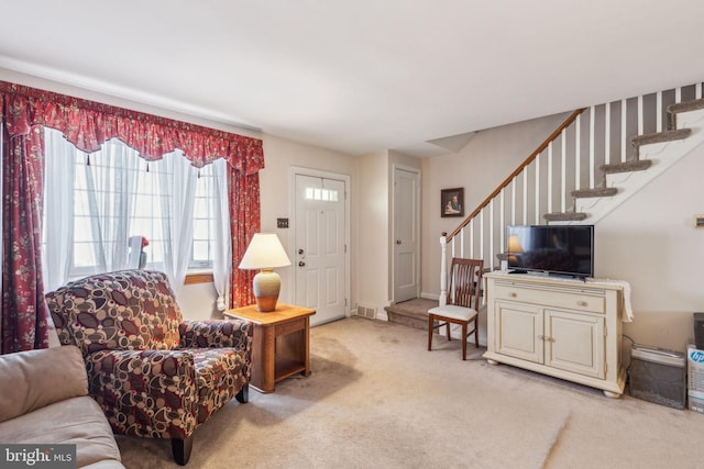 living room featuring light colored carpet