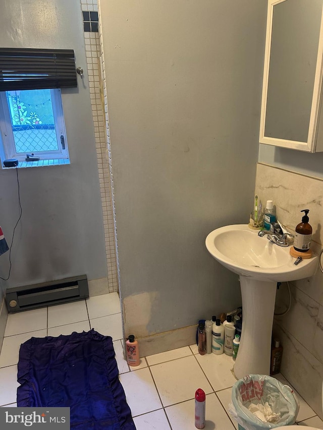 bathroom featuring a baseboard radiator and tile patterned floors