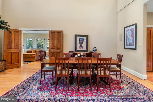 dining area with hardwood / wood-style floors