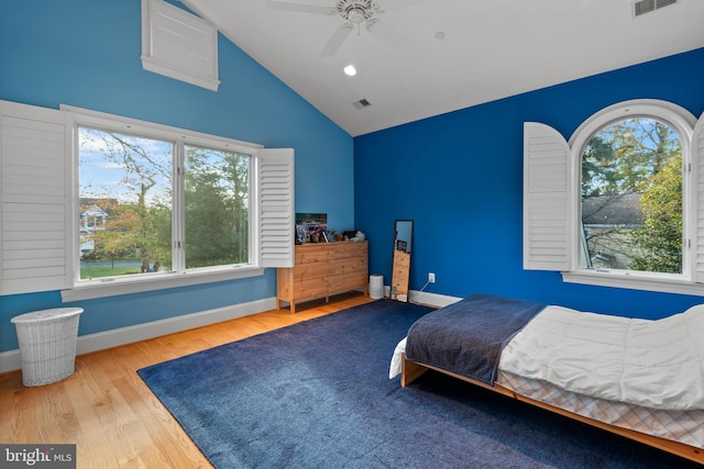 bedroom featuring ceiling fan, wood-type flooring, and vaulted ceiling