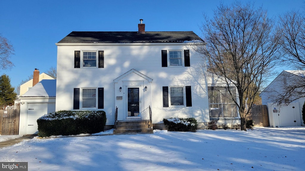 colonial home featuring a garage