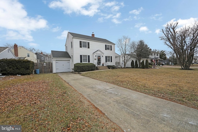 view of front facade featuring a garage and a front yard