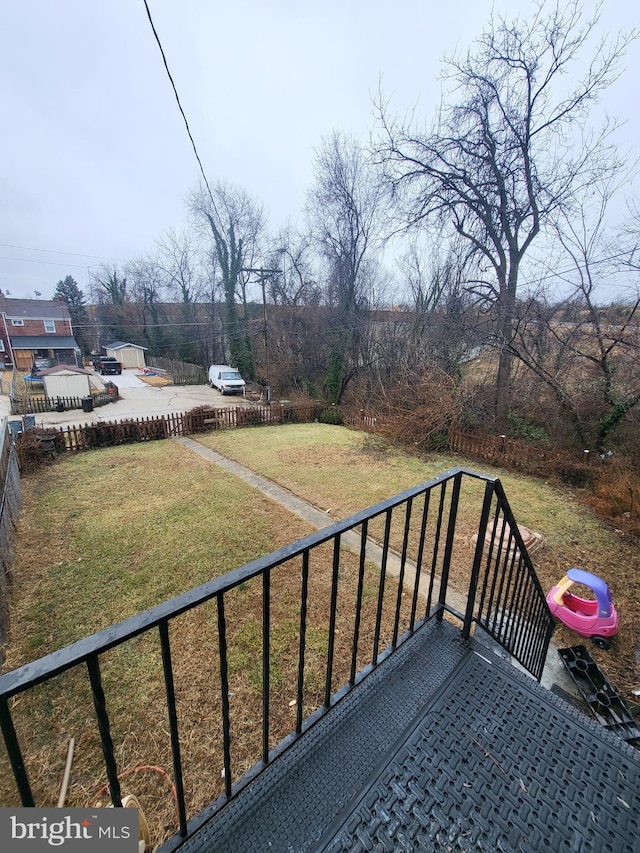 wooden terrace with a yard