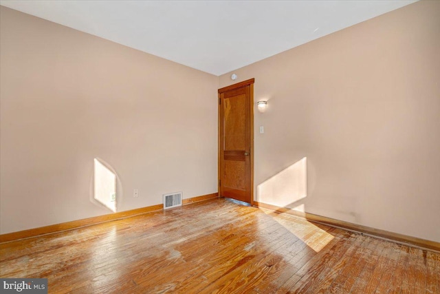 empty room with light hardwood / wood-style floors