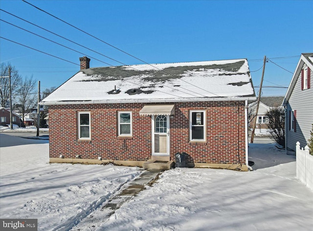 view of snow covered property