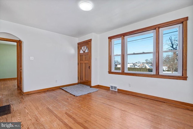 foyer entrance with light hardwood / wood-style flooring