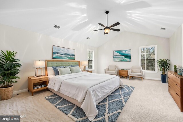 bedroom with light carpet, multiple windows, vaulted ceiling, and visible vents