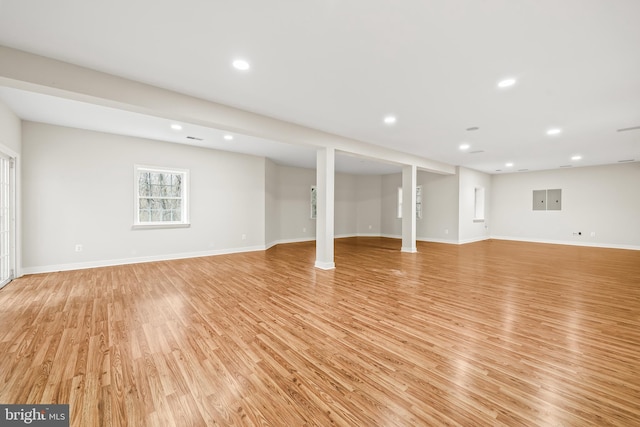 interior space featuring recessed lighting, light wood-style flooring, and baseboards