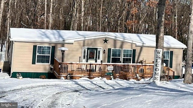 single story home with a wooden deck