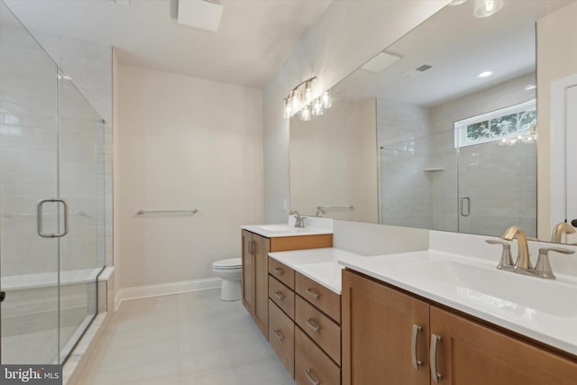 bathroom featuring toilet, vanity, tile patterned floors, and walk in shower