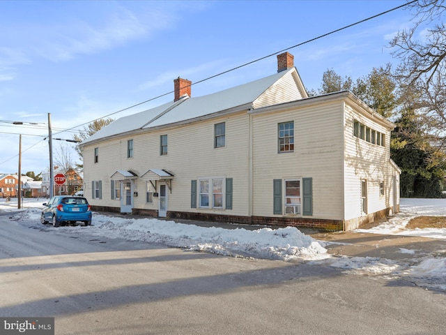 view of front of house featuring cooling unit