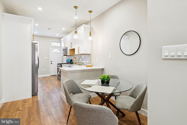 dining area featuring light hardwood / wood-style flooring