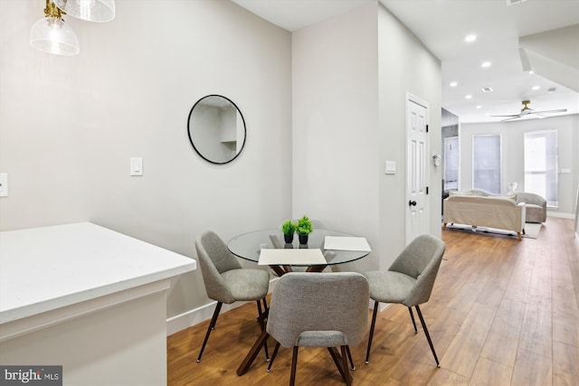 dining area featuring hardwood / wood-style flooring and ceiling fan