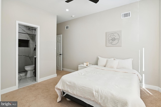 carpeted bedroom featuring ensuite bathroom, a baseboard heating unit, and ceiling fan